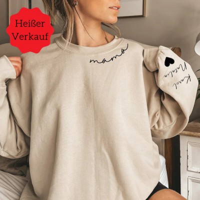 Individuelles Mama-Sweatshirt mit Kindernamen auf dem Ärmel